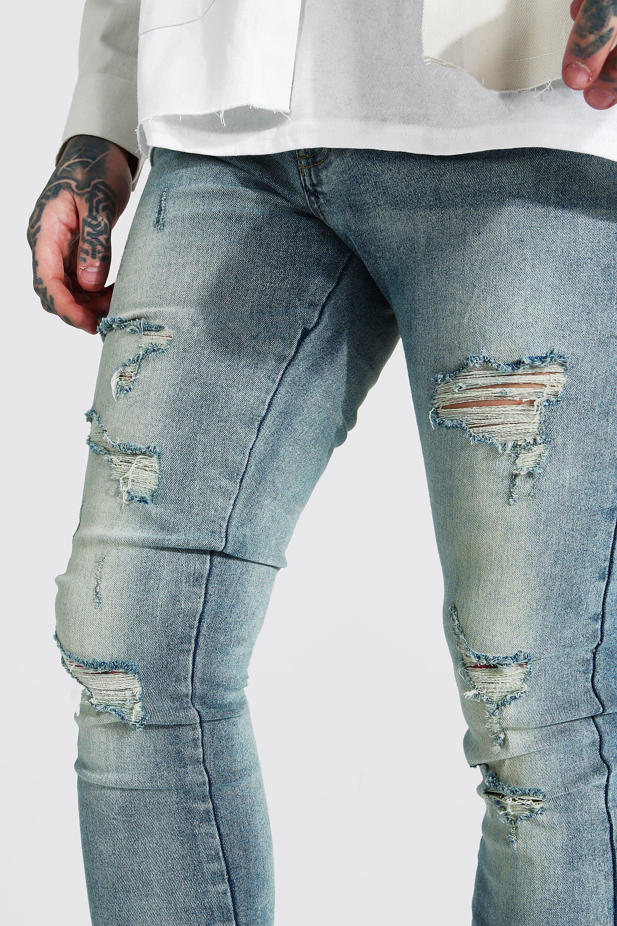 Jeans skinny elasticizzati con strappi all over boohoo IT